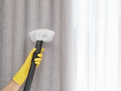 Steam cleaning curtains at a client home in Townsville.